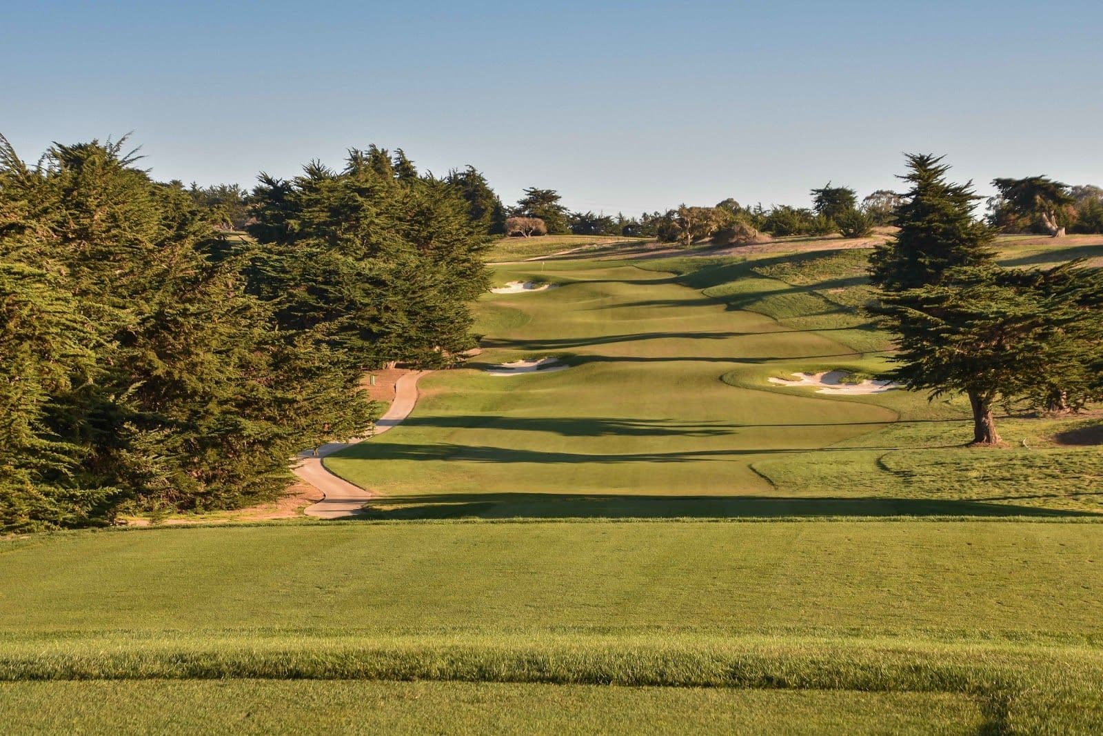 Panoramic Monterey Bay views open up on the back nine — on a clear day you can see across to Santa Cruz.