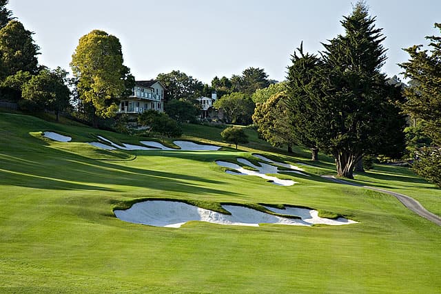 The 18th hole plays uphill to a green guarded by the same ravine that defines much of the back nine.