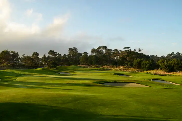 Hole 6 from the tee — The Links at Spanish Bay® plays directly along the Pacific, with ocean wind on every shot.