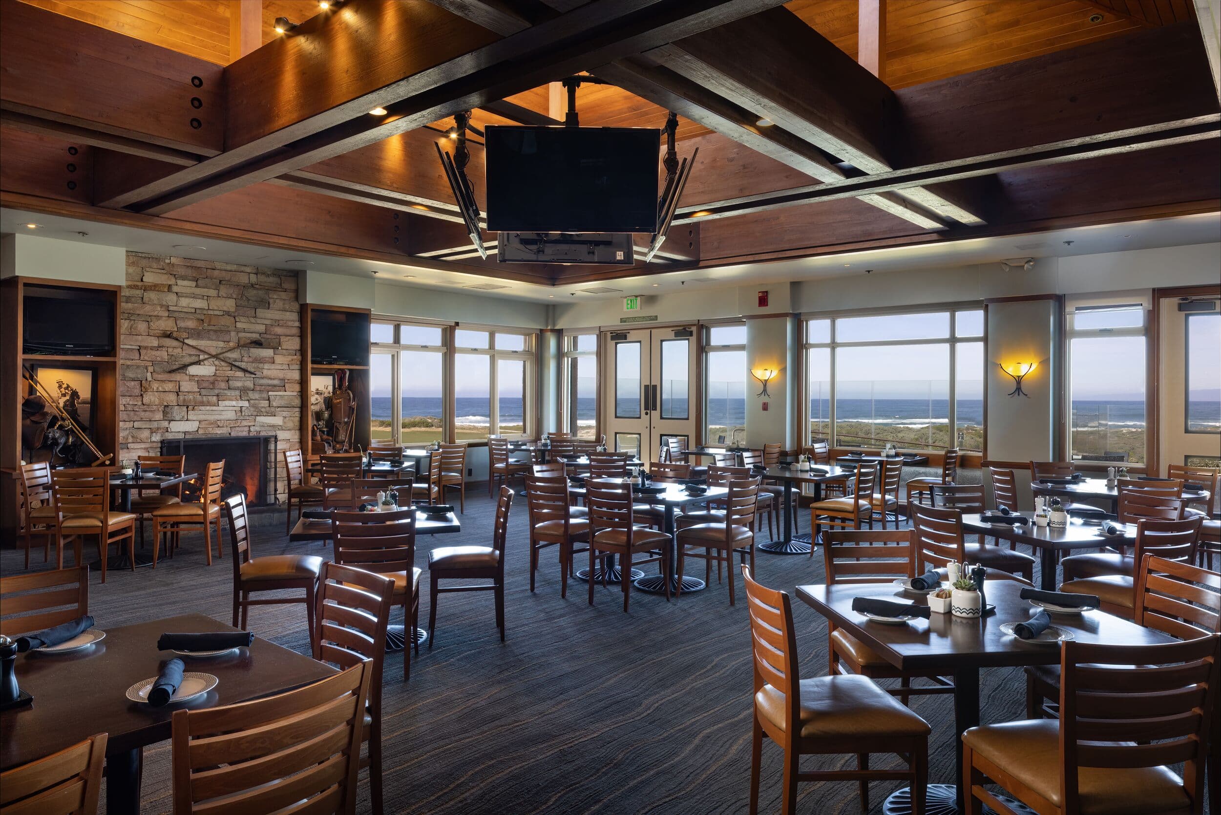 Sticks restaurant interior at The Lodge at Pebble Beach™ — dining room with Pacific Ocean and Links at Spanish Bay views
