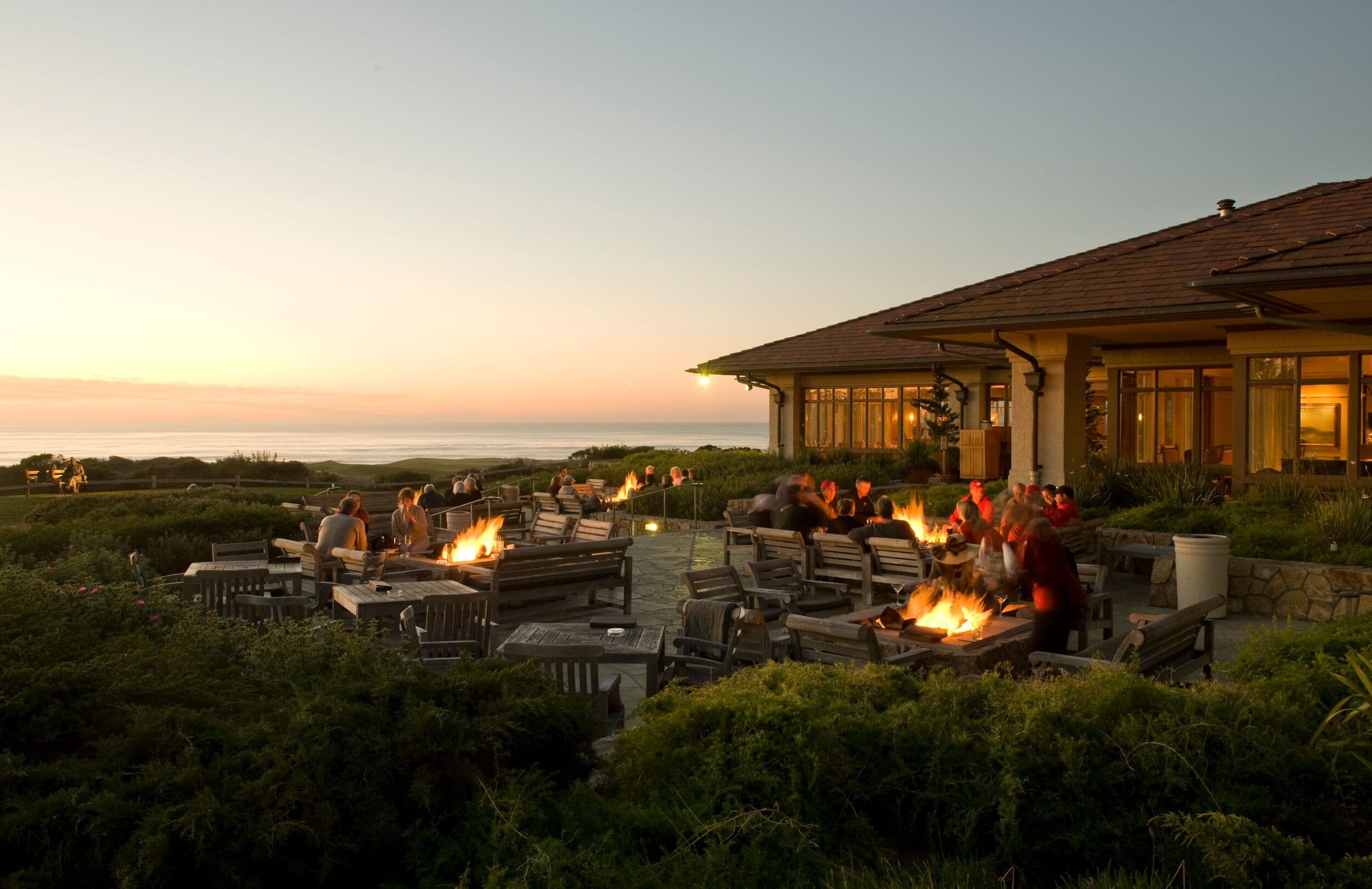 Fire pits at The Inn at Spanish Bay™, Pebble Beach, CA — evening gathering at sunset